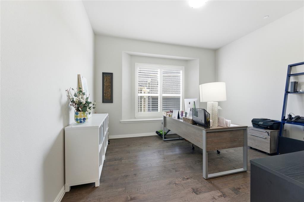 7705 Falcon Ridge Road Denton, TX 76208 - Photo 21 of 40 Office space with dark wood-type flooring and baseboards