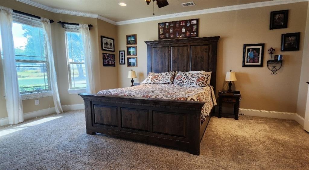 1397 Cr 338 Gainesville Tx 76240 Gainesville, TX 76240 - Photo 19 of 36 a bed sitting in a bedroom next to a window