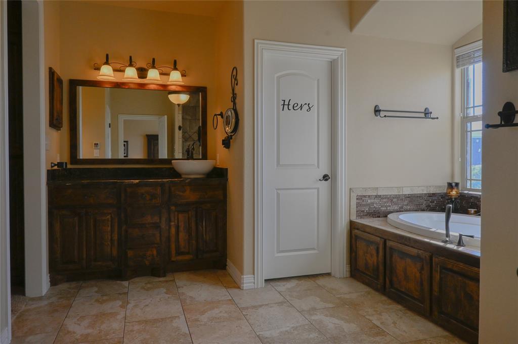 1397 Cr 338 Gainesville Tx 76240 Gainesville, TX 76240 - Photo 20 of 36 a bathroom with a sink and a mirror