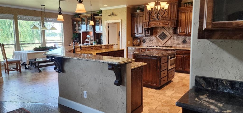 1397 Cr 338 Gainesville Tx 76240 Gainesville, TX 76240 - Photo 4 of 36 a kitchen with stove and cabinets
