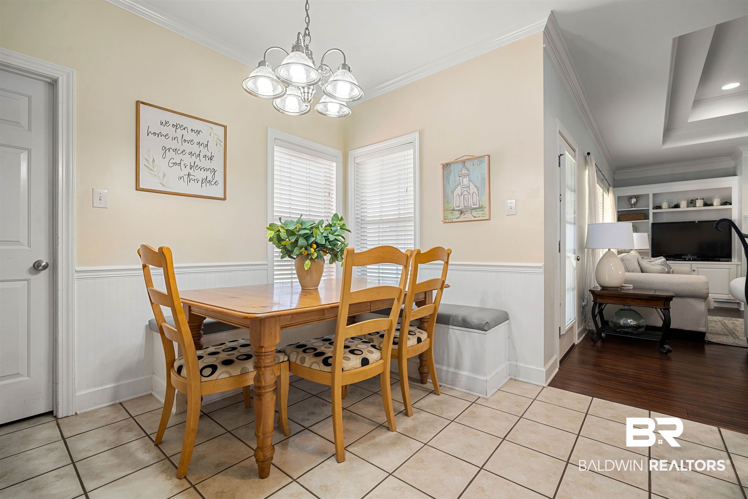 9552 White Castle Road Mobile, AL 36695 - Photo 11 of 31 Dining area with a wainscoted wall, light tile floors, ornamental molding, and an inviting chandelier