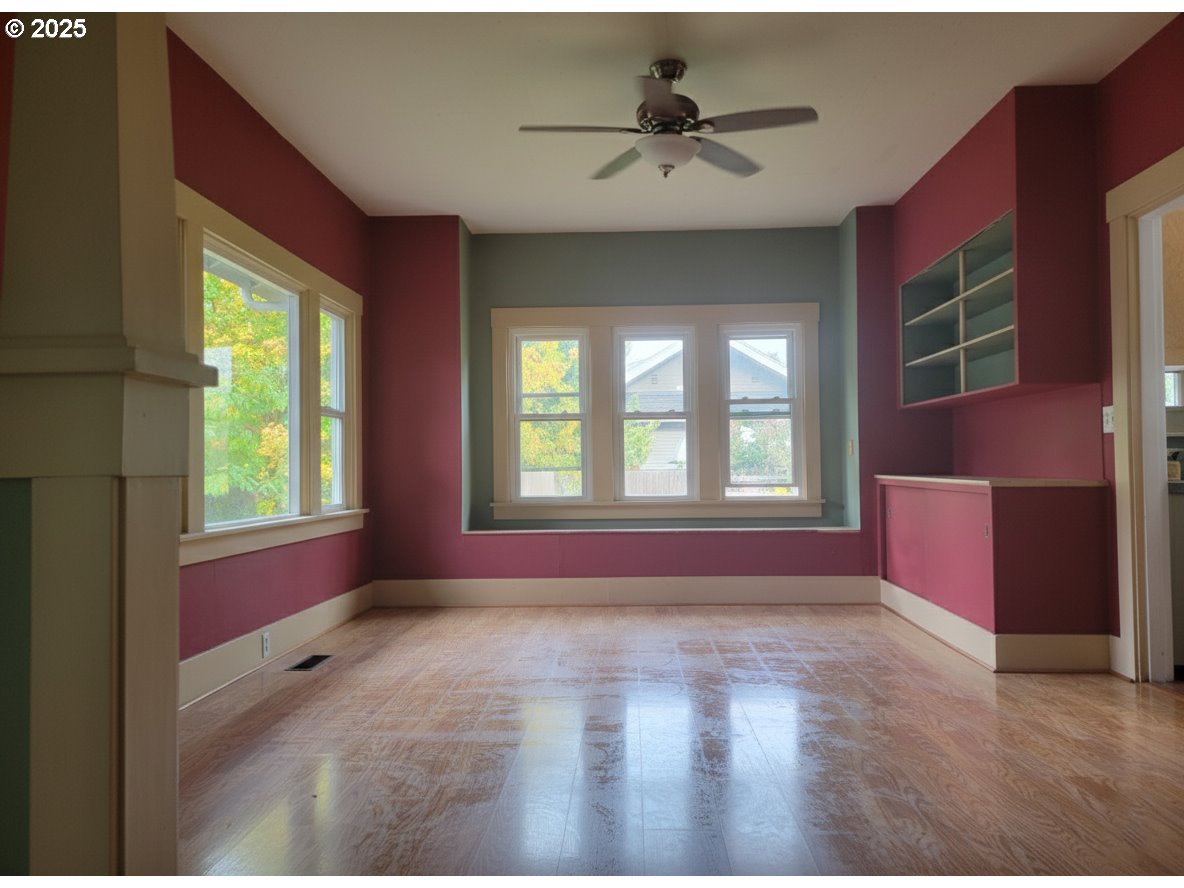 431 Southwest 3rd Avenue Canby, OR 97013 - Photo 6 of 14 a view of livingroom with hardwood floor and window