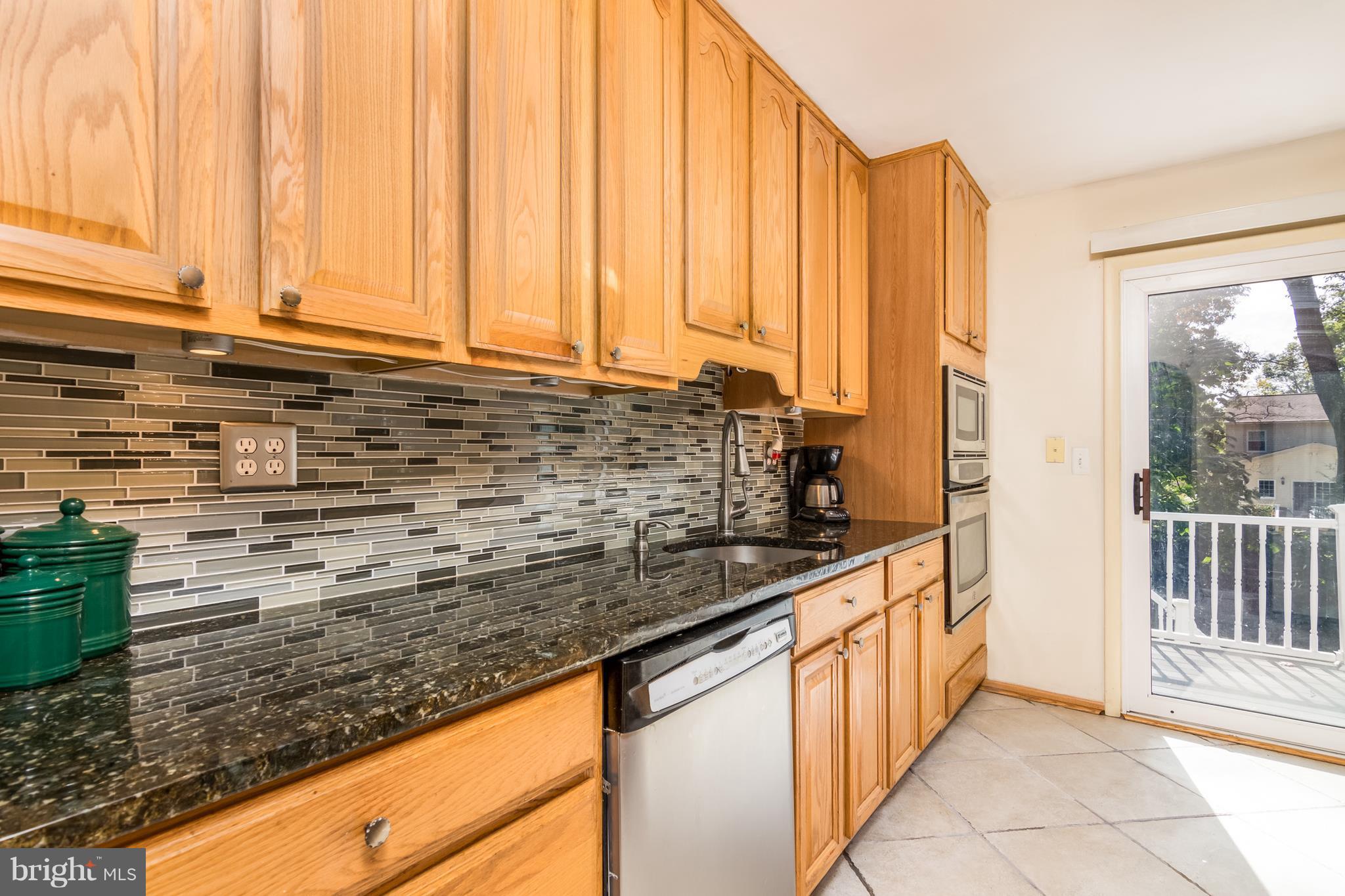 410 Edgewater Road Pasadena, MD 21122 - Photo 9 of 26 Kitchen w/Granite Counters & SS Appliances