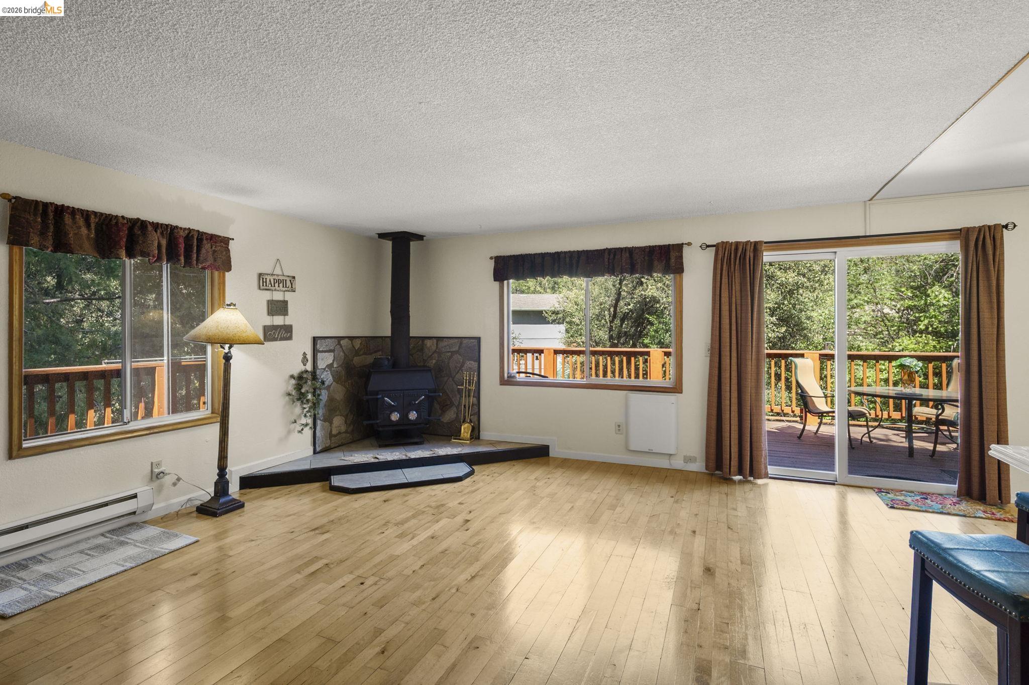 21931 Glenwood Road Sonora, CA 95370 - Photo 12 of 42 a living room with furniture floor to ceiling window and floor to ceiling window