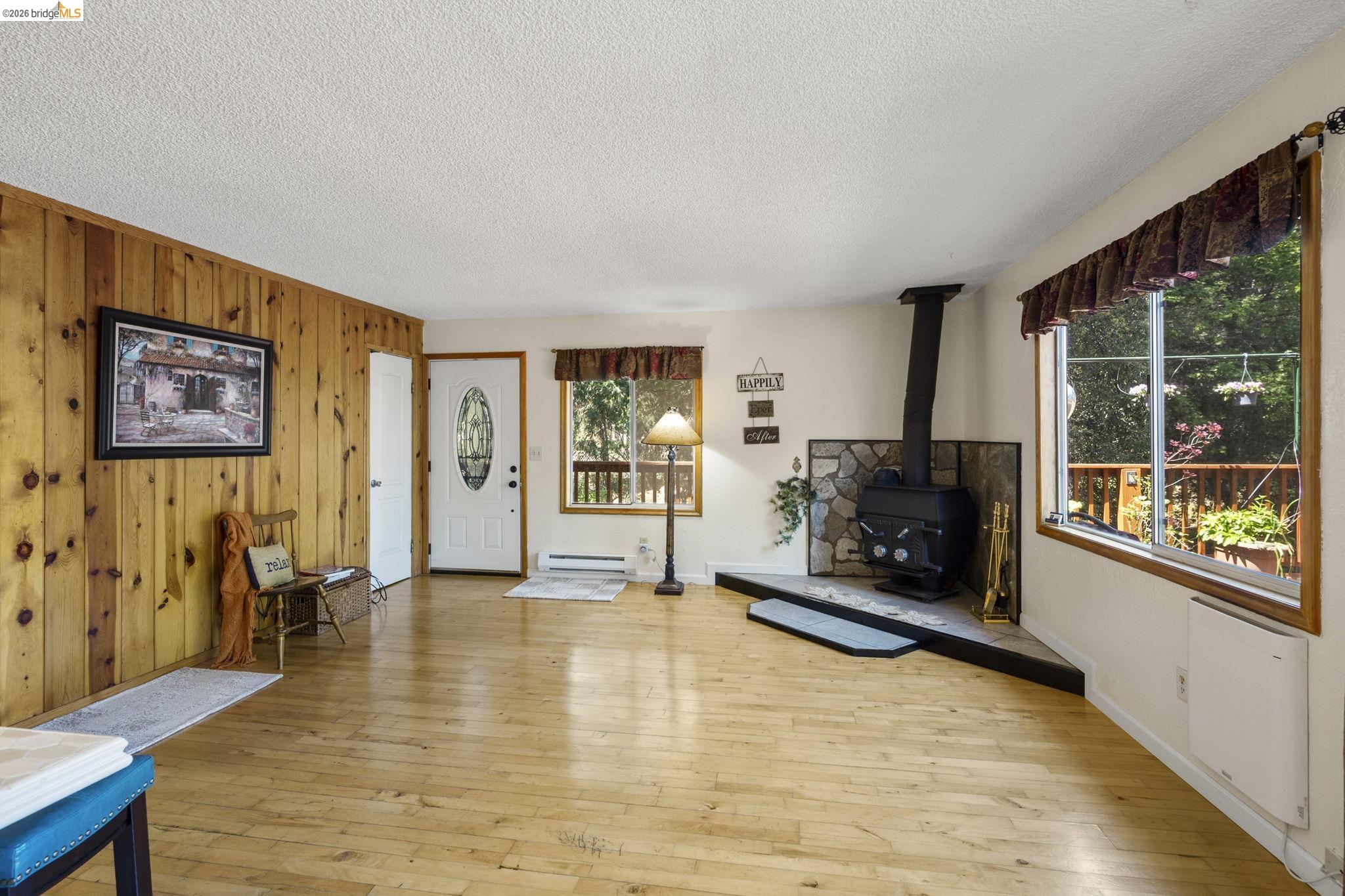 21931 Glenwood Road Sonora, CA 95370 - Photo 15 of 42 a living room with furniture and a fireplace