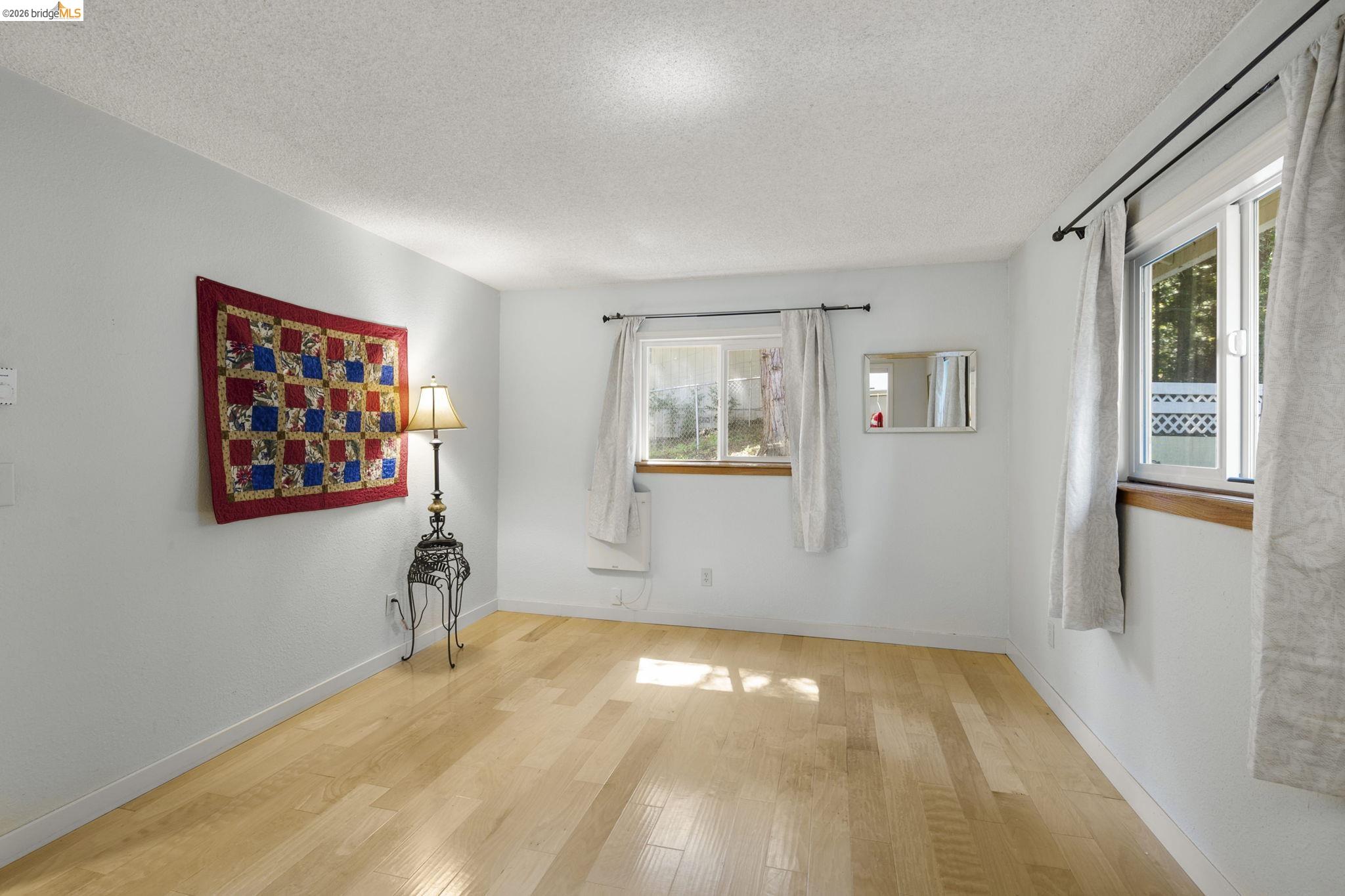21931 Glenwood Road Sonora, CA 95370 - Photo 21 of 42 a view of a bedroom with furniture and windows