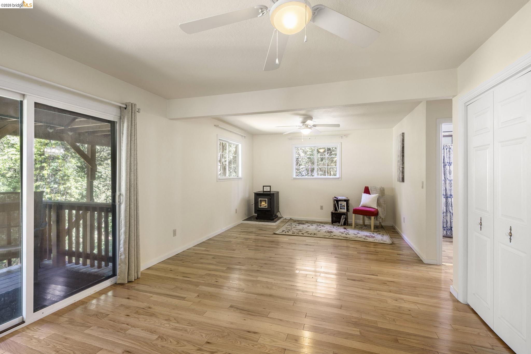 21931 Glenwood Road Sonora, CA 95370 - Photo 26 of 42 a view of a room with wooden floor and windows