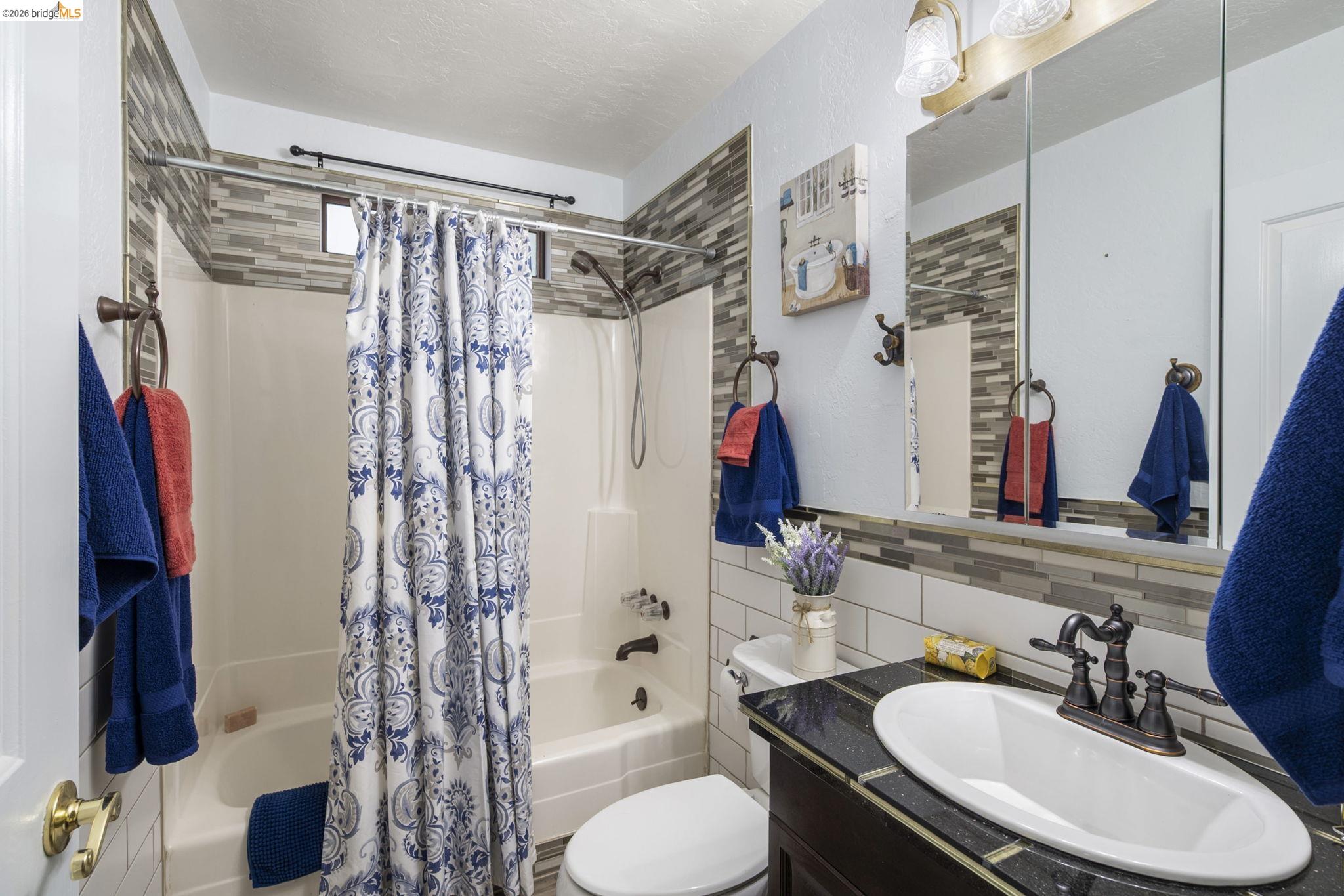 21931 Glenwood Road Sonora, CA 95370 - Photo 28 of 42 a bathroom with a sink toilet and shower