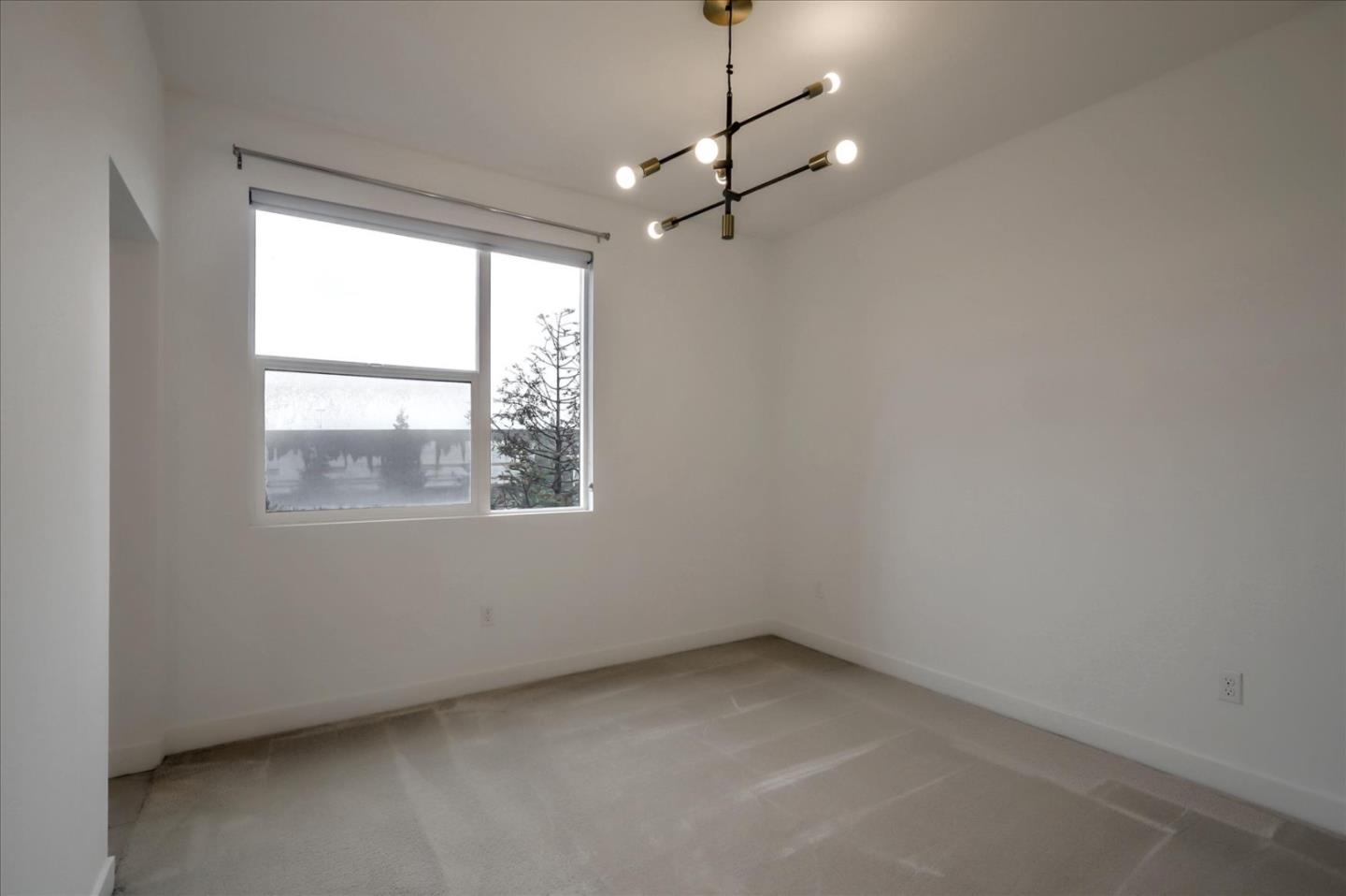 1405 Pullman Way Oakland, CA 94607 - Photo 18 of 36 a view of an empty room with a window