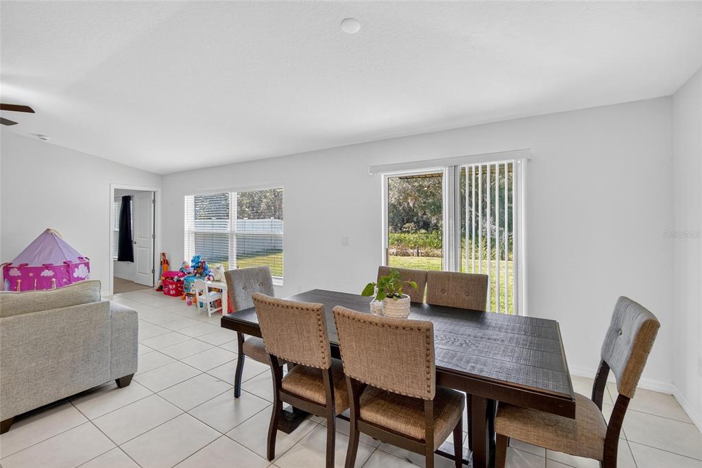 1748 Red Loop Lakeland, FL 33801 - Photo 11 of 66 a dining room with furniture and wooden floor