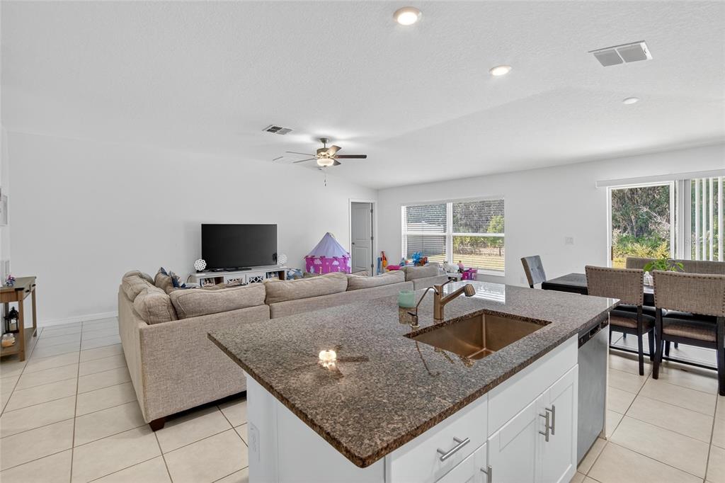 1748 Red Loop Lakeland, FL 33801 - Photo 14 of 66 a living room with furniture and a flat screen tv