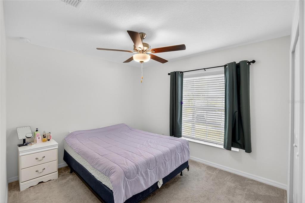 1748 Red Loop Lakeland, FL 33801 - Photo 23 of 66 a bedroom with a bed and a window