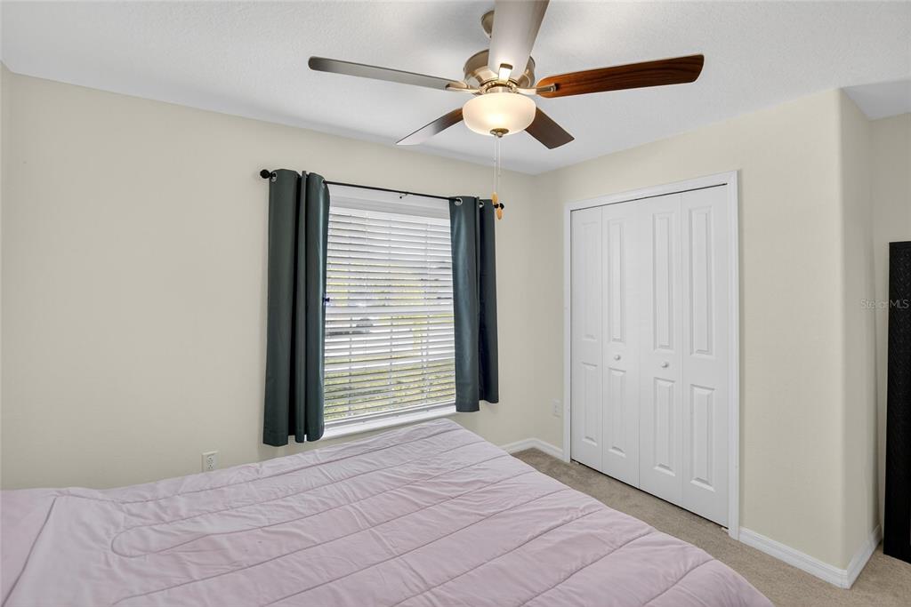 1748 Red Loop Lakeland, FL 33801 - Photo 24 of 66 an empty room with fan window and a ceiling fan
