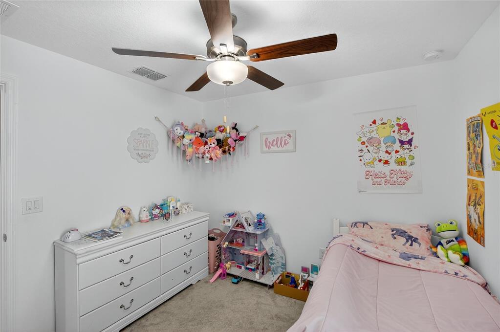 1748 Red Loop Lakeland, FL 33801 - Photo 29 of 66 a bed room with a bed and a chandelier