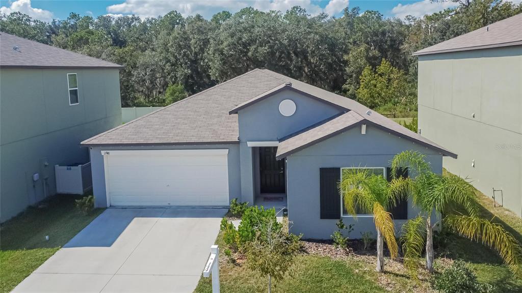 1748 Red Loop Lakeland, FL 33801 - Photo 50 of 66 a front view of a house with garden