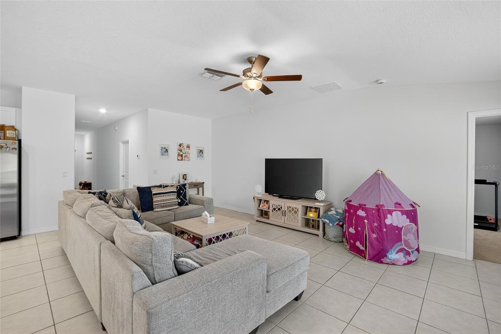 1748 Red Loop Lakeland, FL 33801 - Photo 9 of 66 a living room with furniture and a flat screen tv