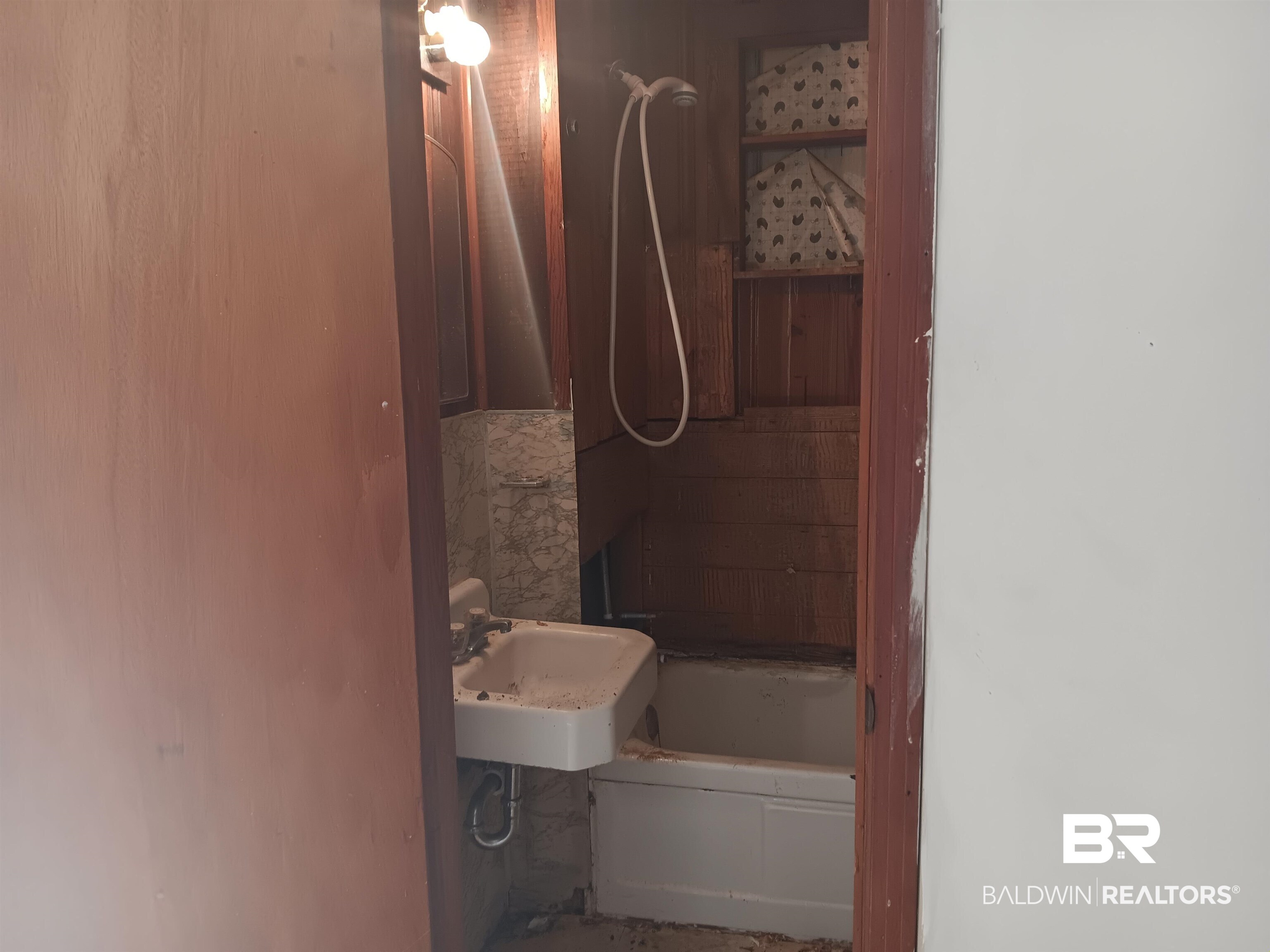 61 Katherine Street Flomaton, AL 36441 - Photo 6 of 13 Bathroom featuring sink and a bath