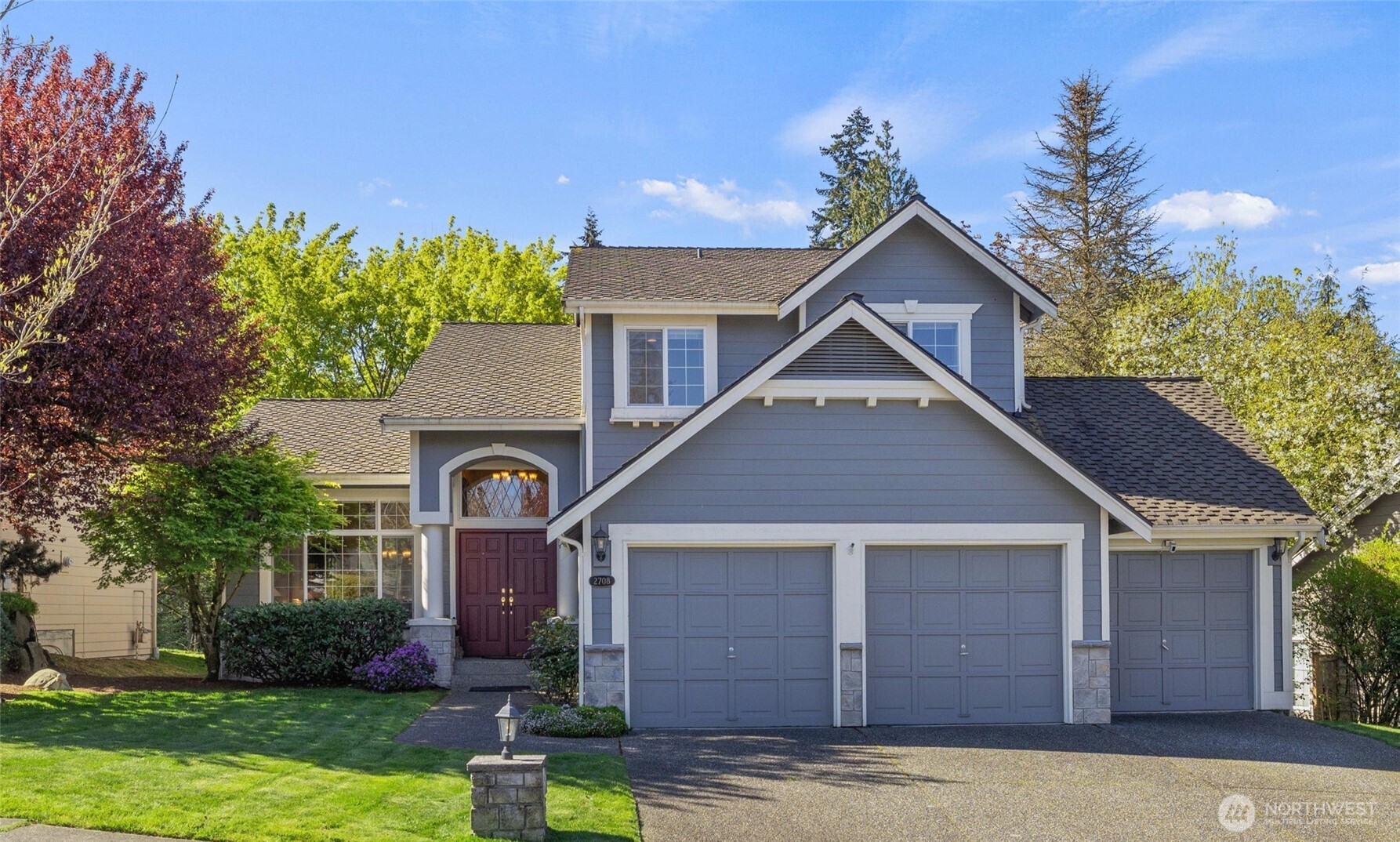 2708 204th Street Southeast Bothell, WA 98021 - Photo 1 of 40 a front view of a house with garden