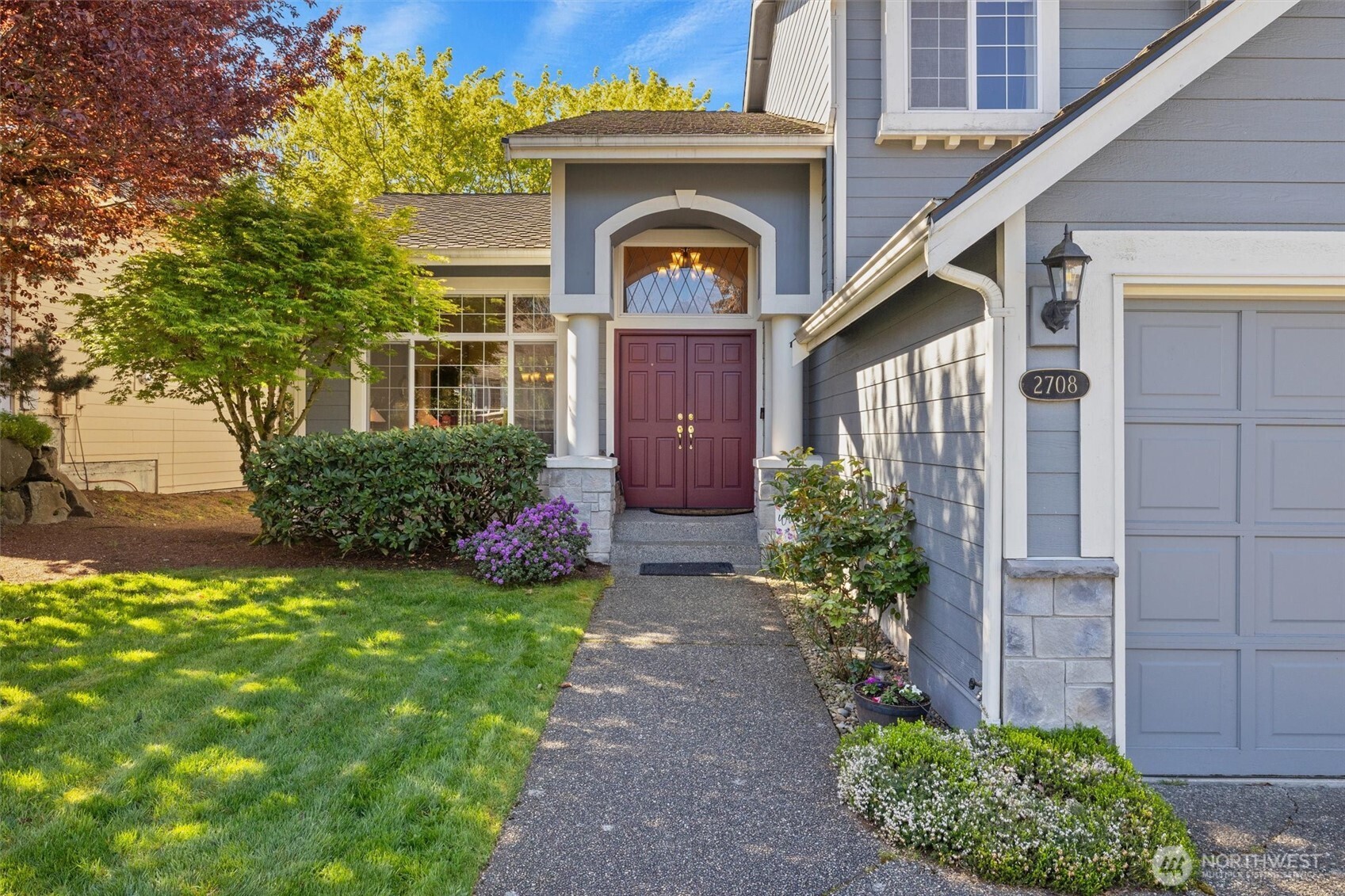 2708 204th Street Southeast Bothell, WA 98021 - Photo 3 of 40 a front view of a house with garden