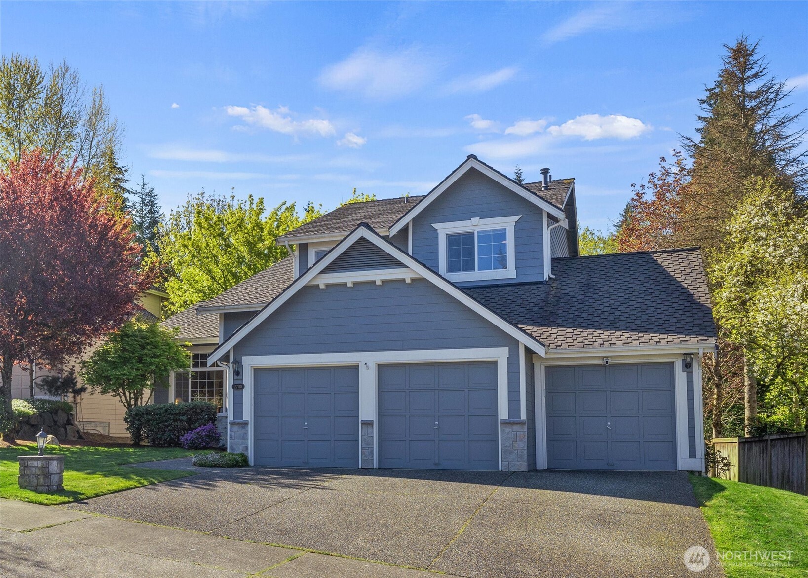 2708 204th Street Southeast Bothell, WA 98021 - Photo 4 of 40 a front view of a house with garden