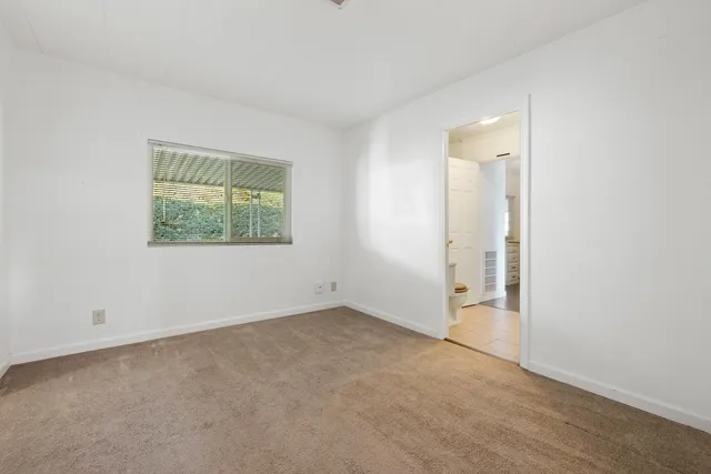 a bathroom with a double vanity sink and mirror