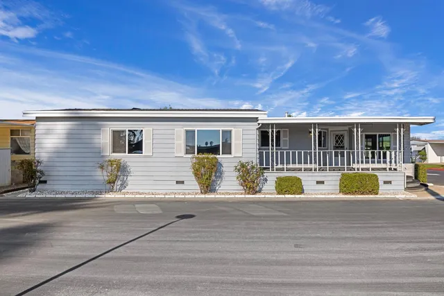 a view of house with swimming pool