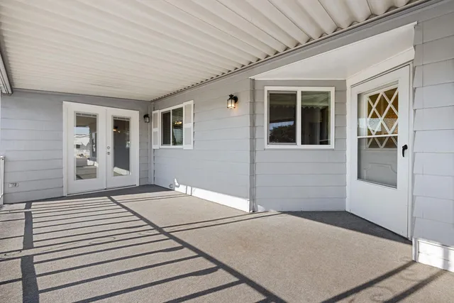 a view of a house with a barbeque
