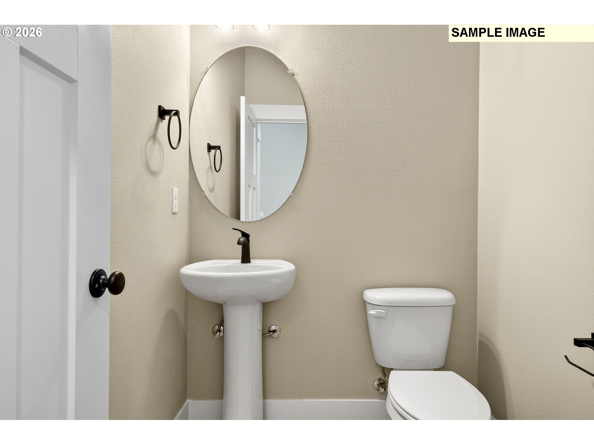 3352 Northeast Sweetwater Road, Unit 80 Estacada, OR 97023 - Photo 40 of 48 a bathroom with a toilet sink and mirror
