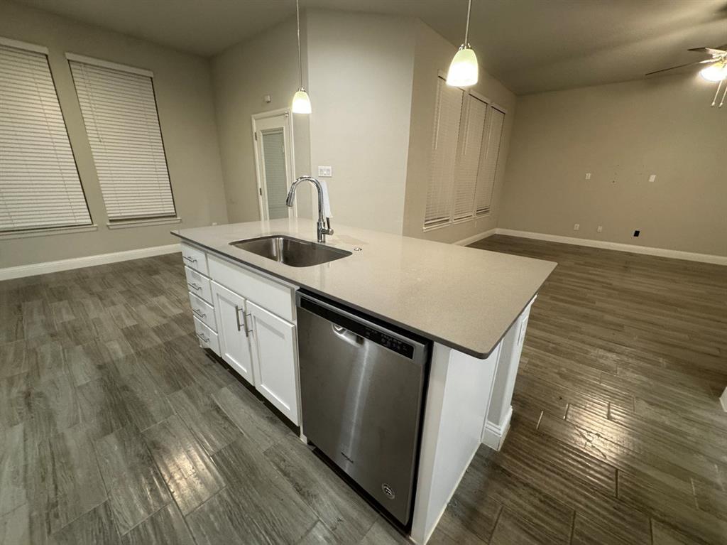 3432 Cornerstone Lane Midlothian, TX 76065 - Photo 16 of 40 a kitchen with stainless steel appliances granite countertop a sink a stove cabinets and wooden floor