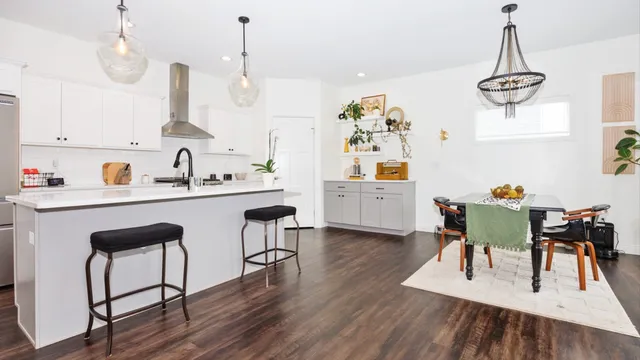 a view of kitchen and dining room with wooden floor