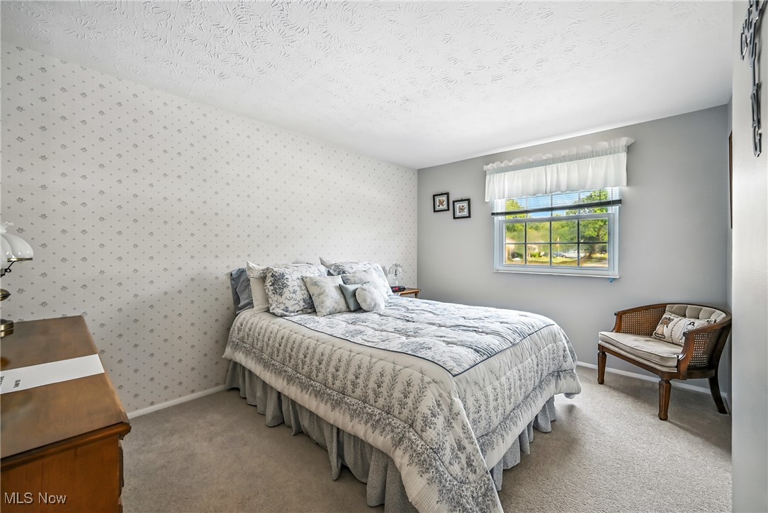 7797 Raglan Drive Northeast Warren, OH 44484 - Photo 32 of 50 Carpeted bedroom with a textured ceiling and baseboards