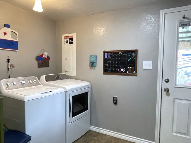 a view of a hallway with washer and dryer