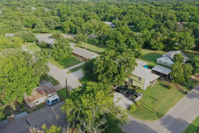 an aerial view of residential house with outdoor space