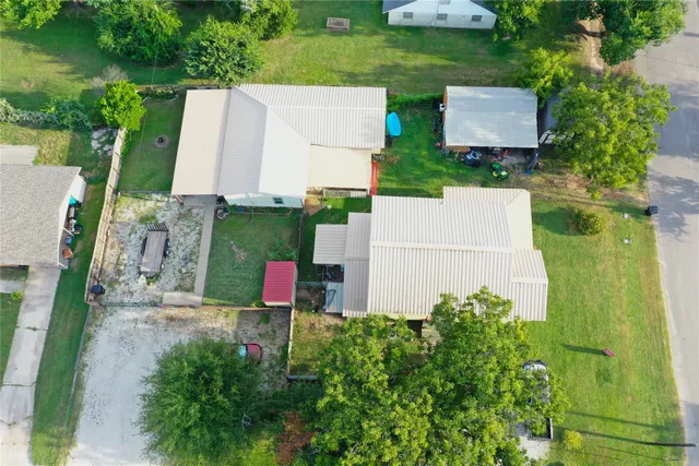 an aerial view of a house with yard swimming pool and outdoor seating