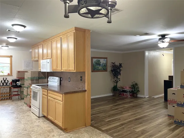 a kitchen with a stove and cabinets