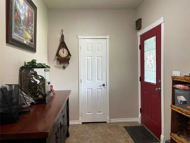 a view of a workspace with furniture and closet