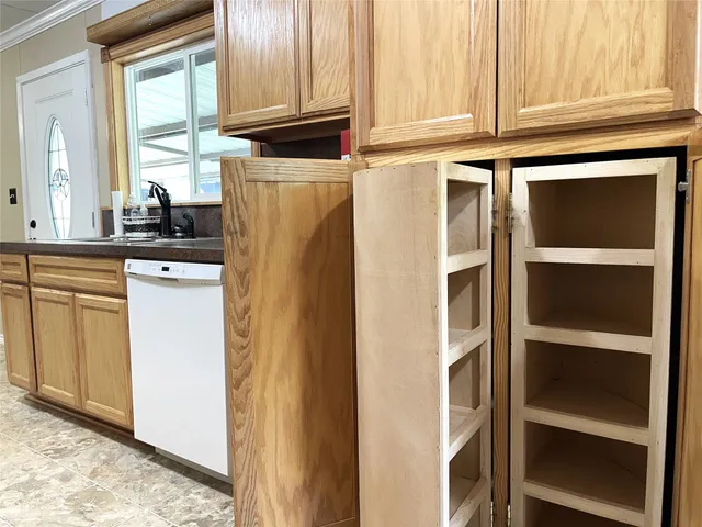 a kitchen with stainless steel appliances granite countertop a refrigerator and cabinets