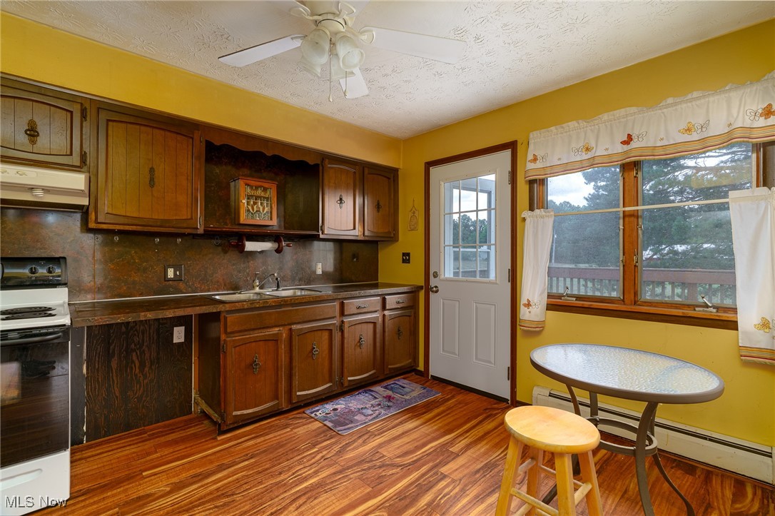 6747 Giddings Road Rootstown, OH 44272 - Photo 9 of 39 Kitchen with new door leading to side wood deck