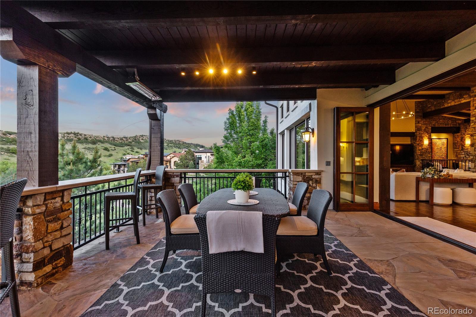 7208 Raphael Lane Littleton, CO 80125 - Photo 16 of 46 a outdoor space with patio lots of furniture and garden view