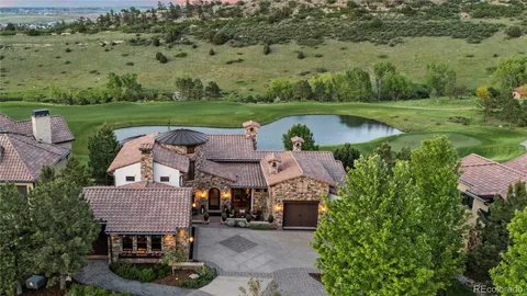 an aerial view of a house with big yard basket ball court and outdoor seating