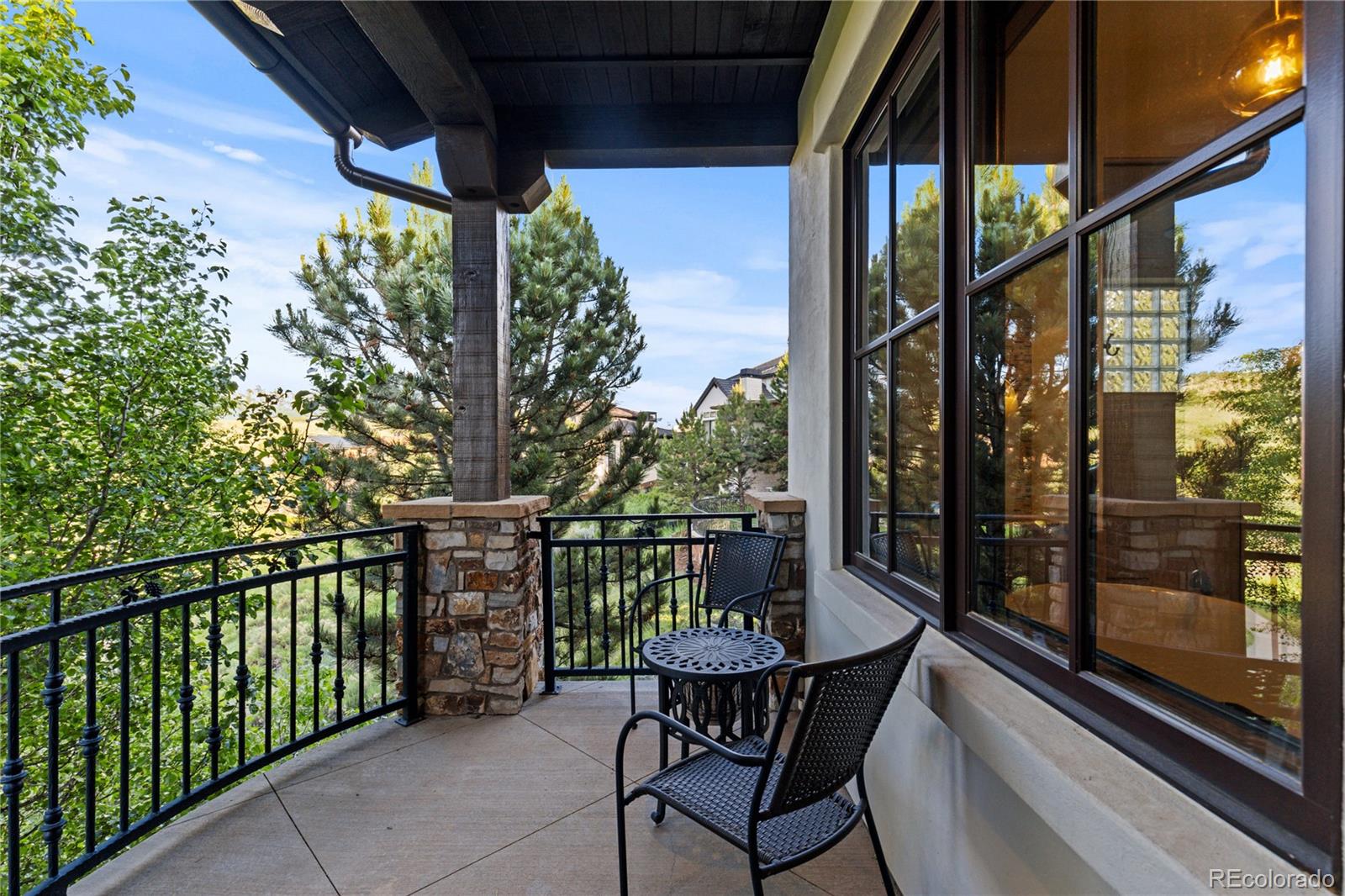 7208 Raphael Lane Littleton, CO 80125 - Photo 22 of 46 a view of a chair and table in the balcony