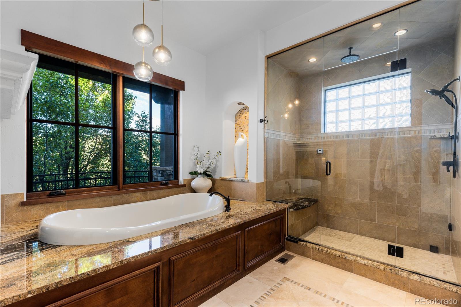 7208 Raphael Lane Littleton, CO 80125 - Photo 23 of 46 a bathroom with a granite countertop sink and a large mirror
