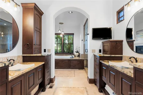 a large kitchen with a stove and a sink