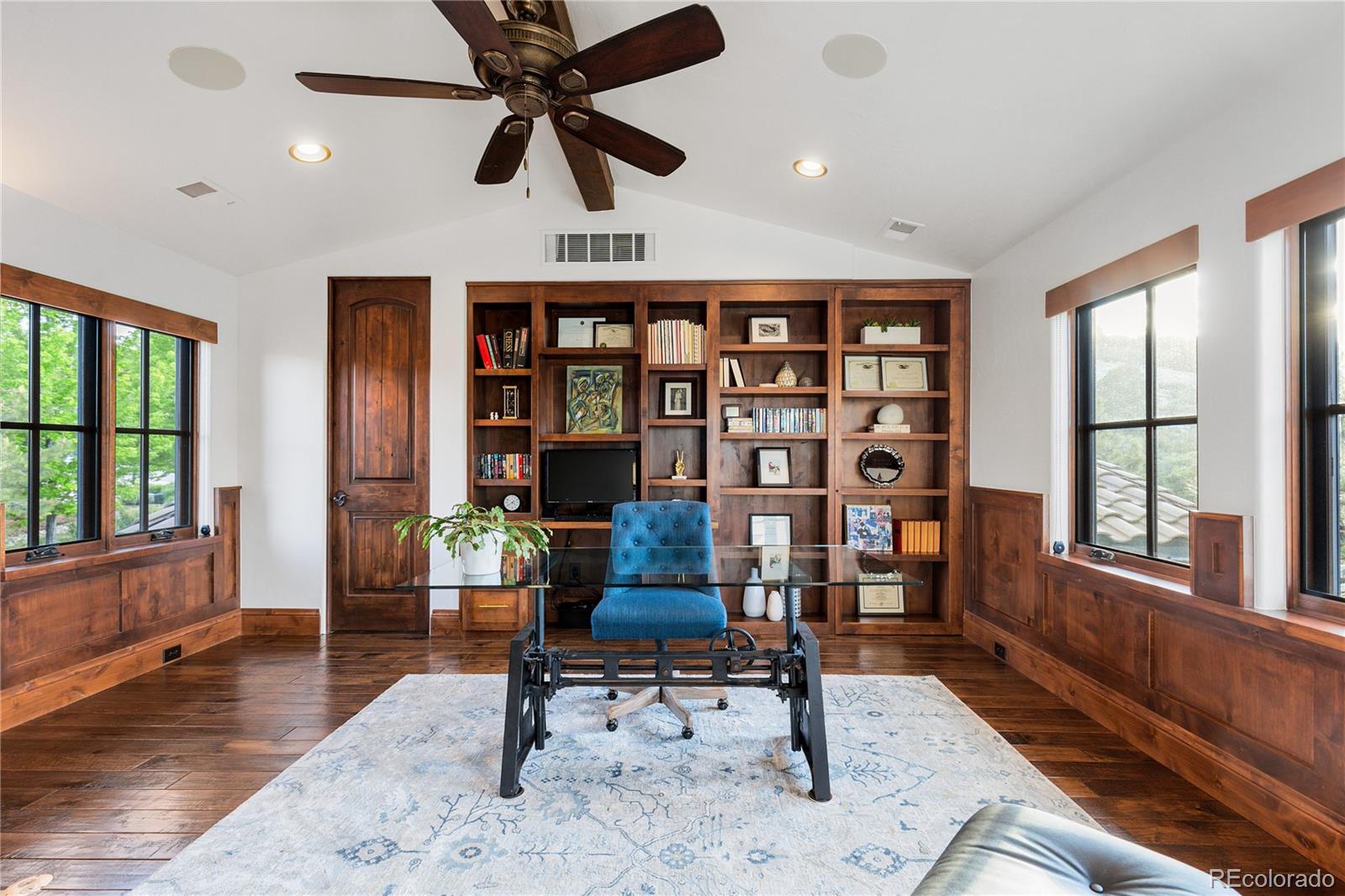 7208 Raphael Lane Littleton, CO 80125 - Photo 25 of 46 a living room with furniture and a window