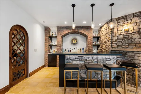 a kitchen with a table and chairs