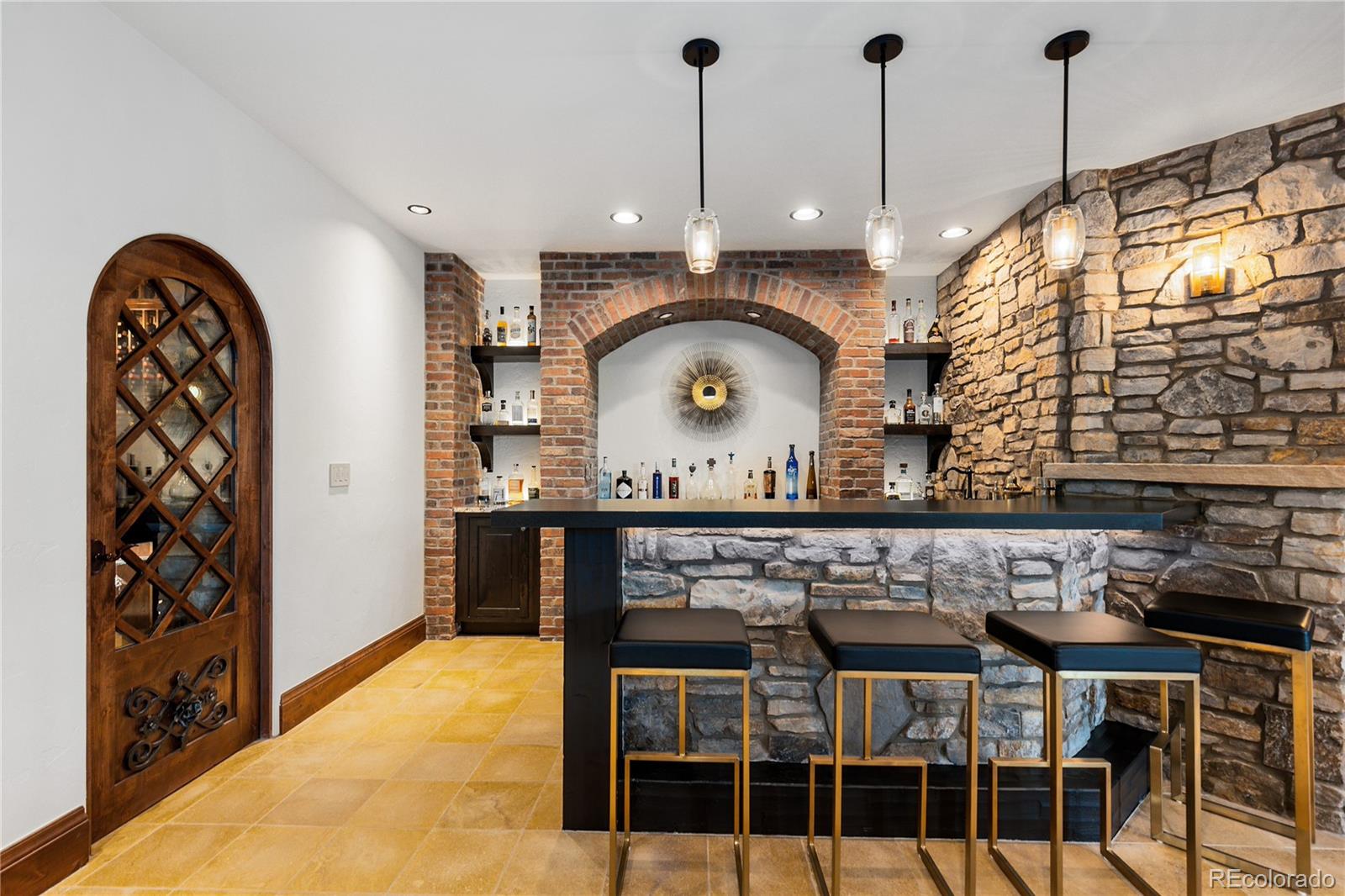 7208 Raphael Lane Littleton, CO 80125 - Photo 32 of 47 a kitchen with a table and chairs