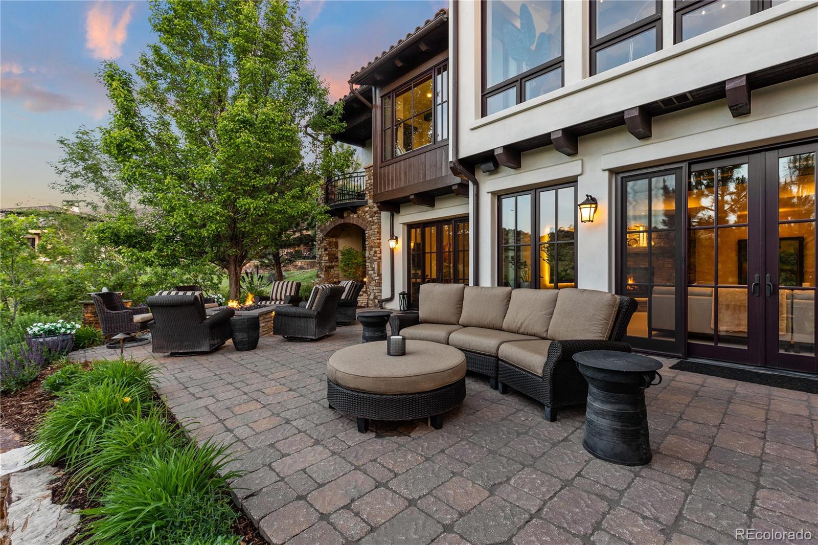 7208 Raphael Lane Littleton, CO 80125 - Photo 38 of 46 a view of a patio with a chairs and a fountain