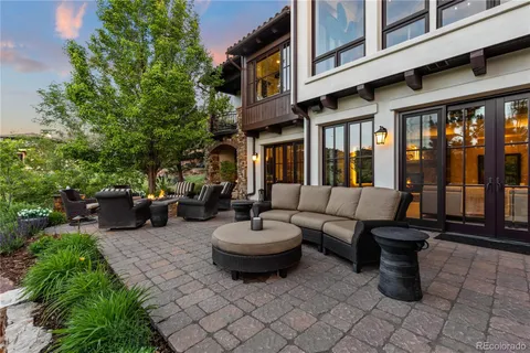 a view of a patio with a chairs and a fountain