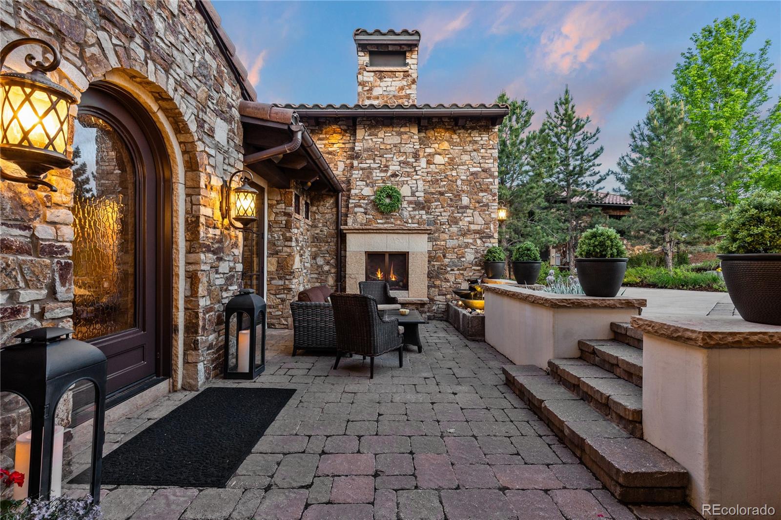 7208 Raphael Lane Littleton, CO 80125 - Photo 6 of 46 a view of a patio with couches table and chairs and potted plants
