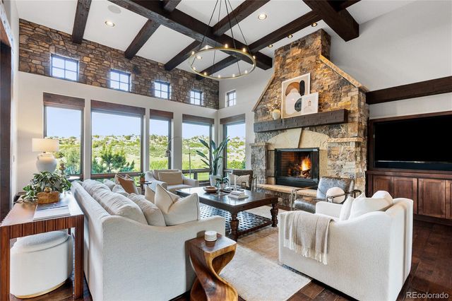 a living room with fireplace furniture and a flat screen tv